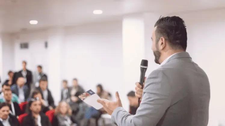 A professional giving a presentation or speaking at a conference